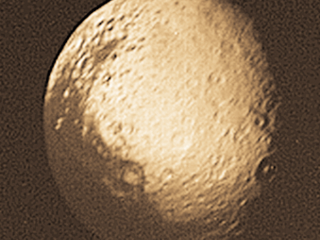 Iapetus: Saturn’s Disappearing Moon