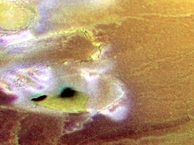 Calderas And Cliffs Near Io’s South Pole