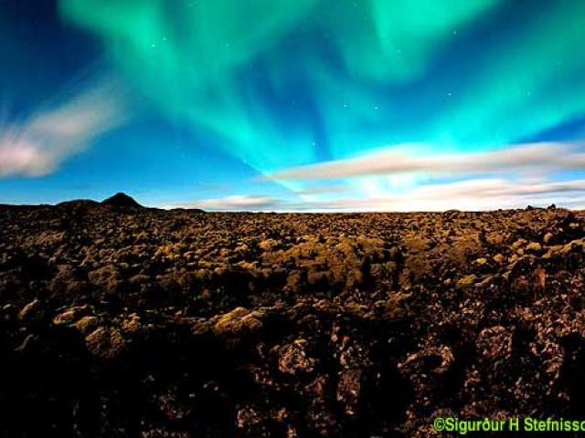 Aurora Over Clouds