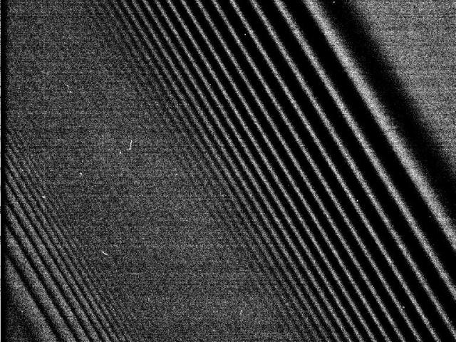 Cassini Images Density Waves in Saturns Rings