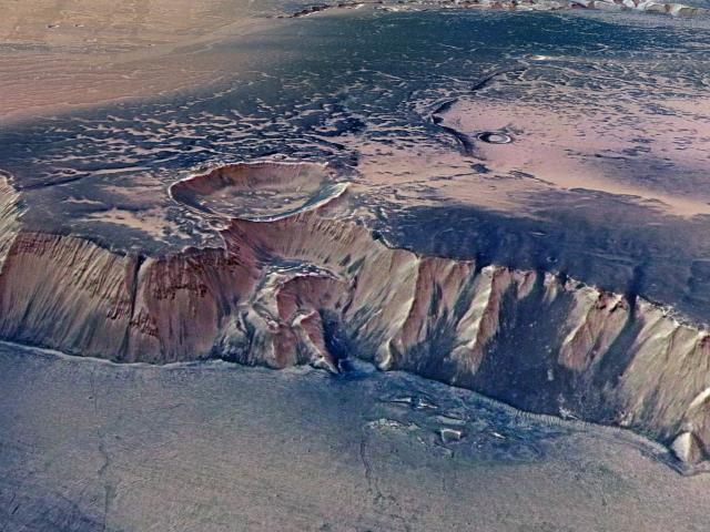 High Cliffs Surrounding Echus Chasma on Mars