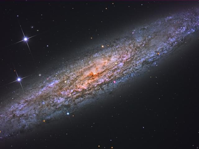 NGC 253: Dusty Island Universe