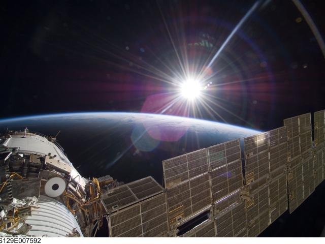 Bright Sun and Crescent Earth from the Space Station