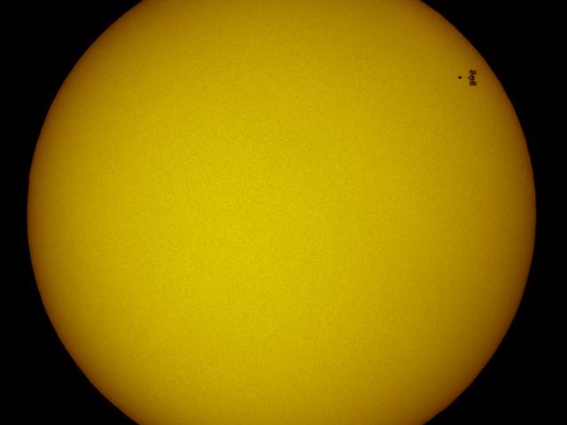Station and Shuttle Transit the Sun