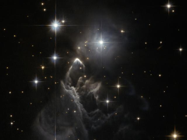 IRAS 05437 2502: An Enigmatic Star Cloud from Hubble