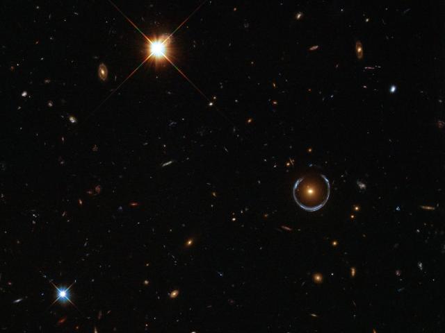 A Horseshoe Einstein Ring from Hubble