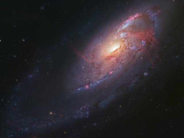 The Arms of M106
