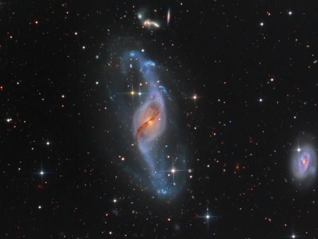 Twisting with NGC 3718