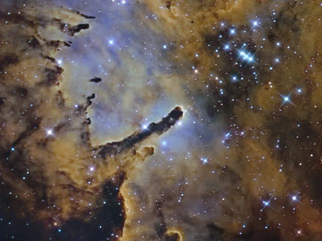 NGC 6823: Cloud Sculpting Star Cluster