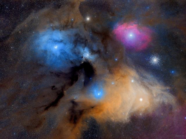 The Colorful Clouds of Rho Ophiuchi