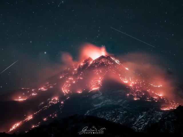 Stars over an Erupting Volcano