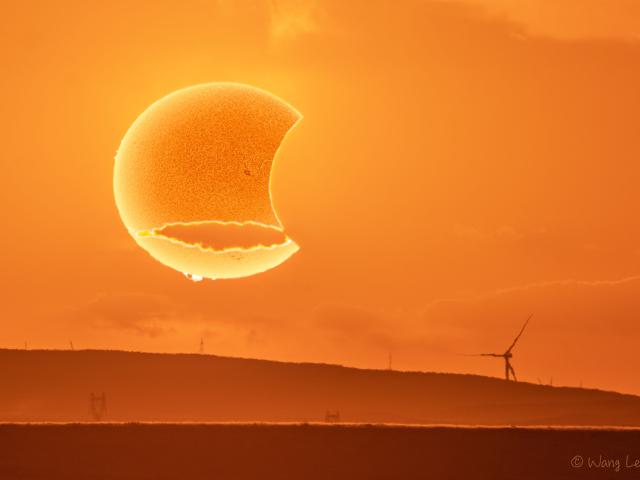 A Paper Moon Solar Eclipse