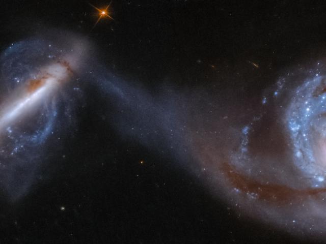 Arp 87: Merging Galaxies from Hubble