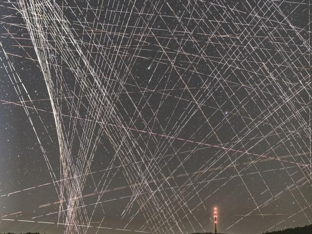 Comet R3 PanSTARRS Behind Satellite Trails