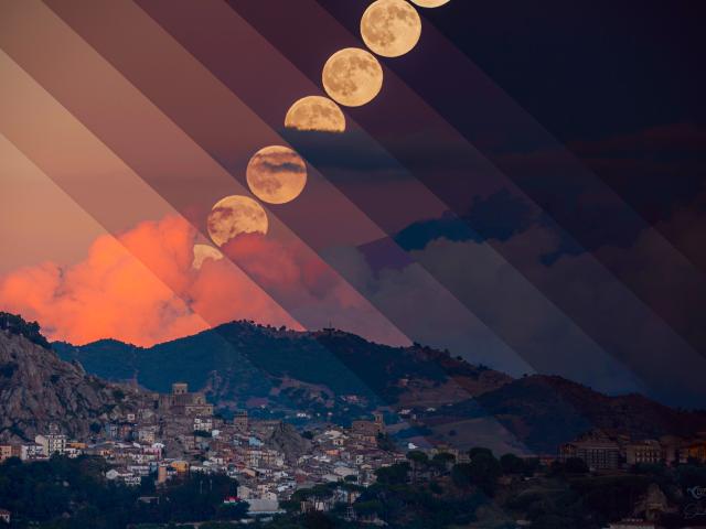 Harvest Moon with Erupting Mount Etna