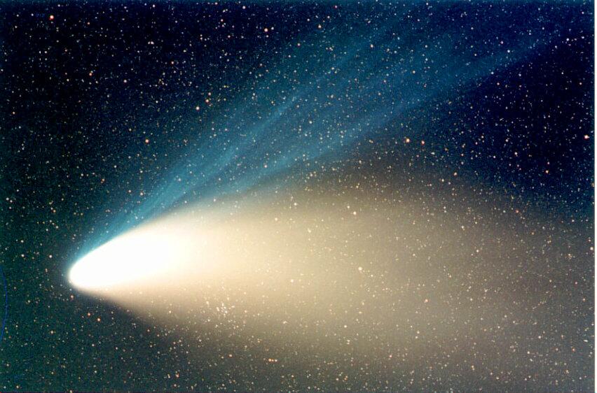 A Star Cluster Through Hale-Bopp’s Tail