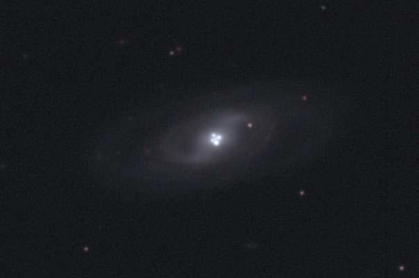 The Einstein Cross Gravitational Lens