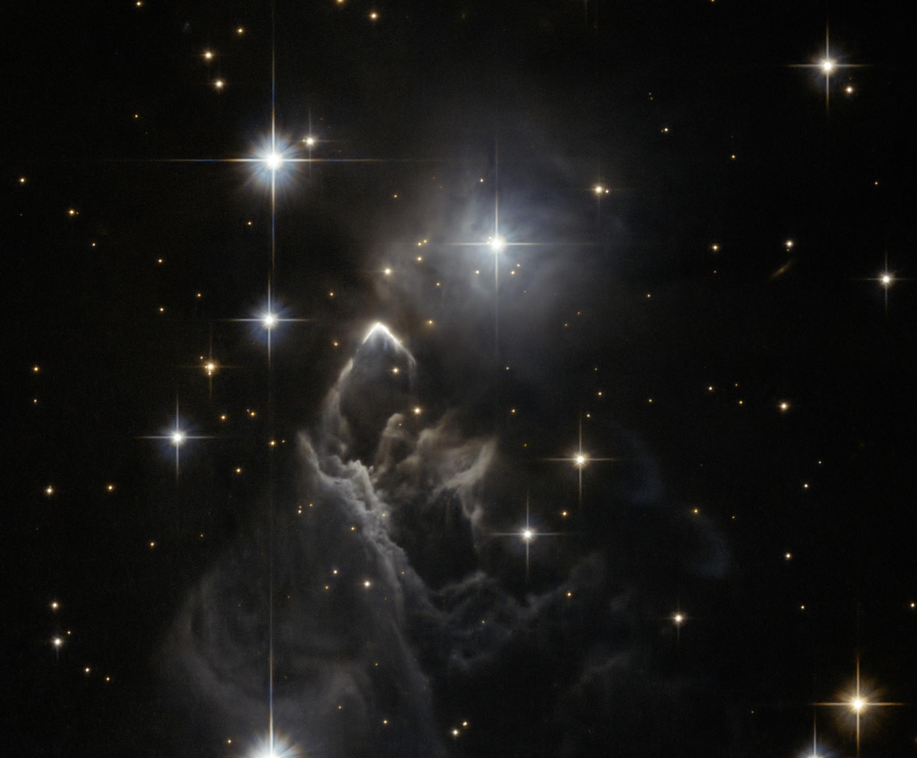 IRAS 05437 2502: An Enigmatic Star Cloud from Hubble