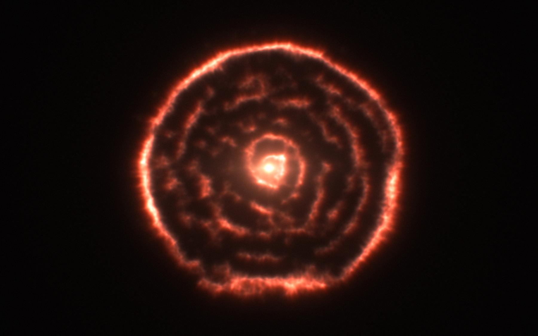 A Spiral Nebula Surrounding Star R Sculptoris