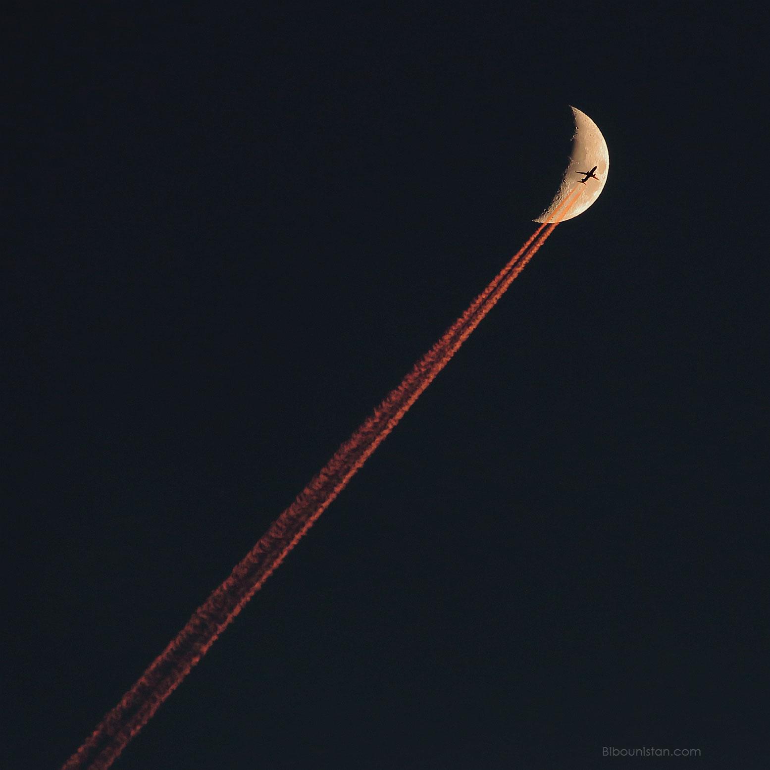 Plane Crossing a Crescent Moon