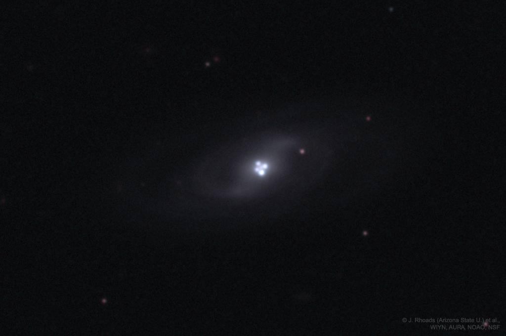 The Einstein Cross Gravitational Lens