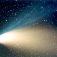 A Star Cluster Through Hale-Bopp’s Tail