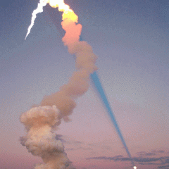Shuttle Plume Shadow Points to Moon