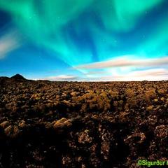 Aurora Over Clouds