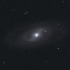 The Einstein Cross Gravitational Lens