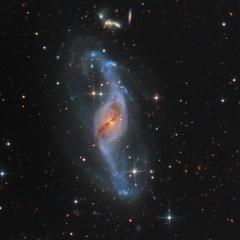 Twisting with NGC 3718