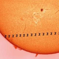 A Space Station Crosses a Busy Sun